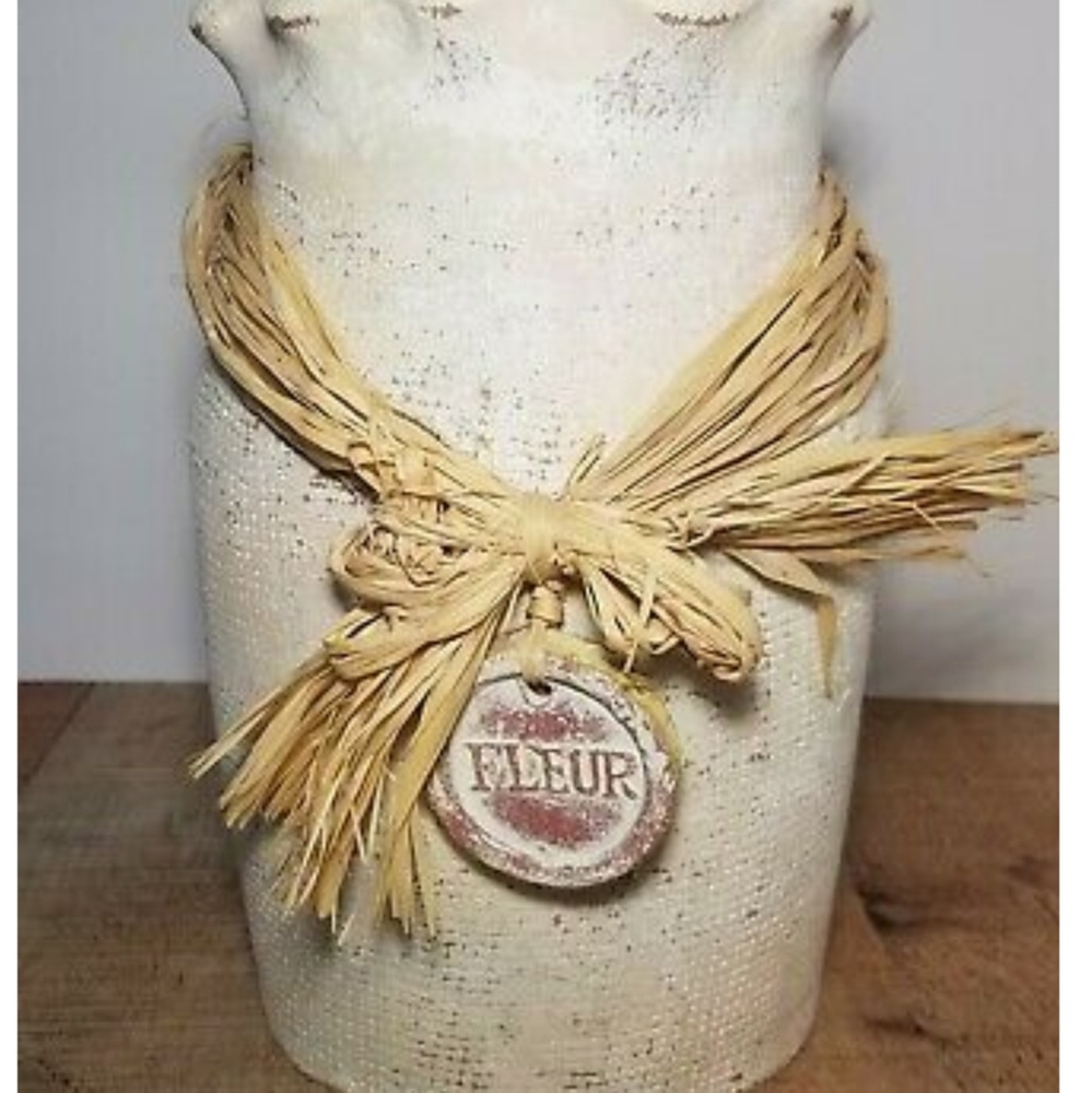 Handcrafted antique white vase made of clay
